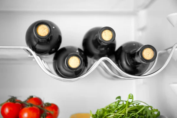 Wine bottles and vegetables — Stock Photo, Image