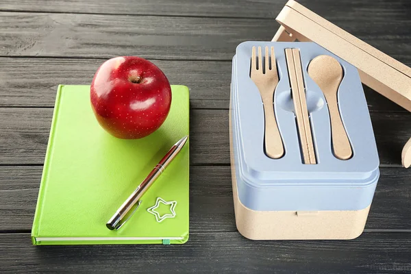 Appetizing red apple and lunch box — Stock Photo, Image