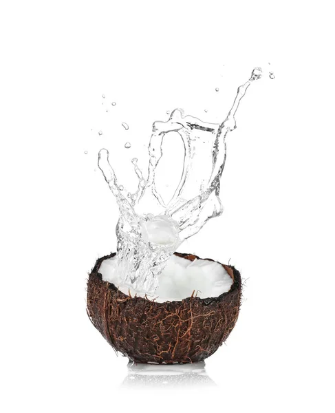 Cracked coconut with splashes of water — Stock Photo, Image