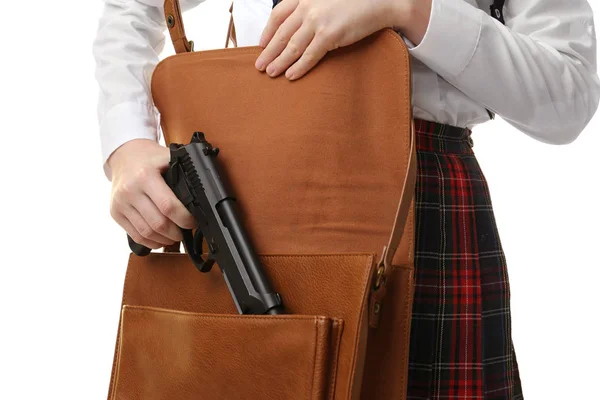 Schoolgirl hiding gun behind back — Stock Photo, Image