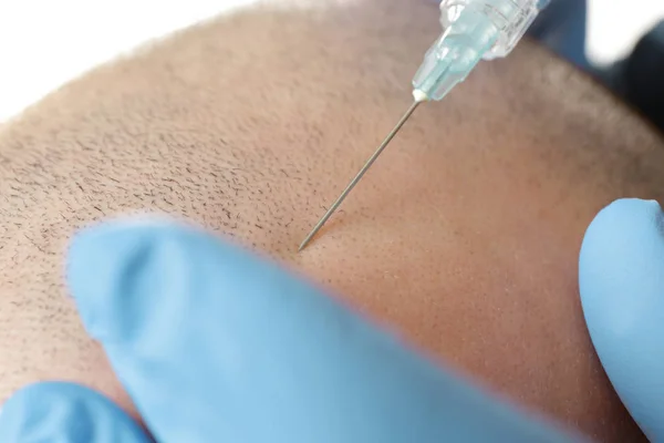 Man receiving stimulating injection — Stock Photo, Image