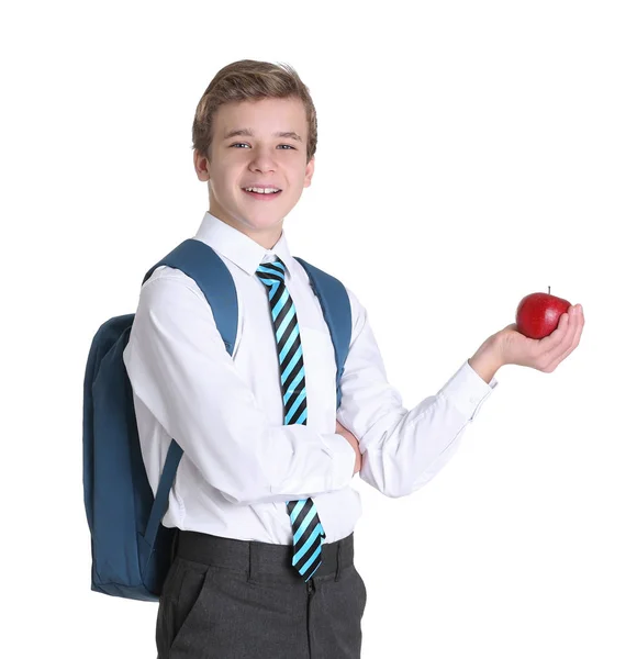 Lindo colegial con manzana sobre fondo blanco — Foto de Stock