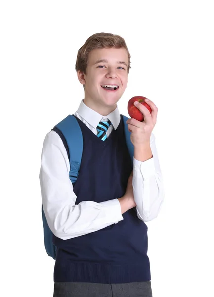 Lindo colegial con manzana sobre fondo blanco — Foto de Stock