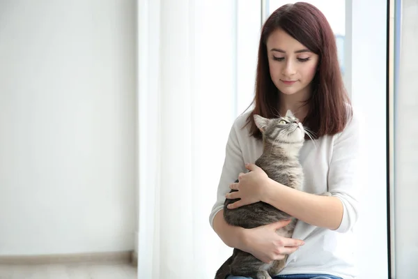 Beautiful woman with cute cat — Stock Photo, Image