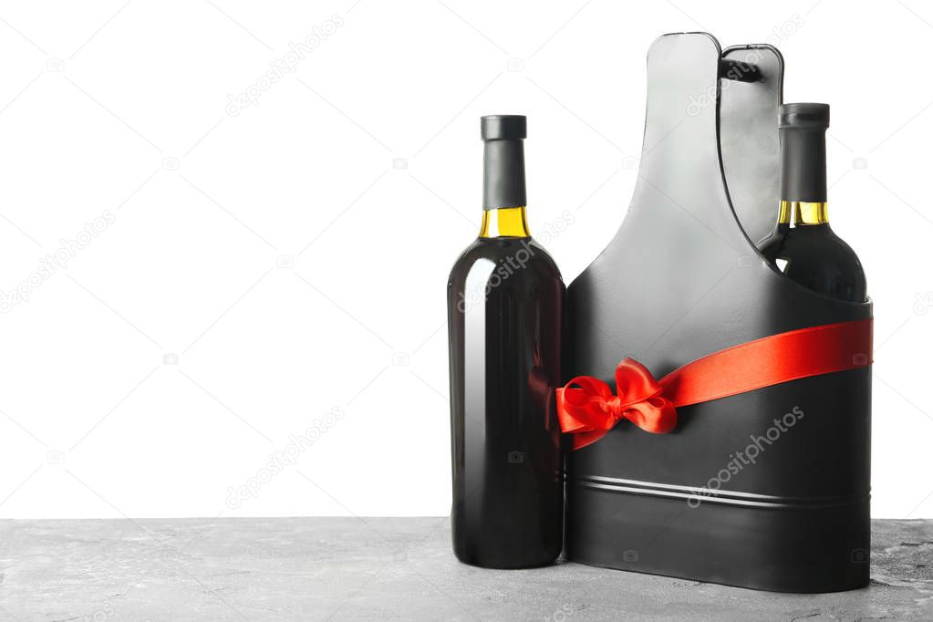 Table with wine bottles and gift box