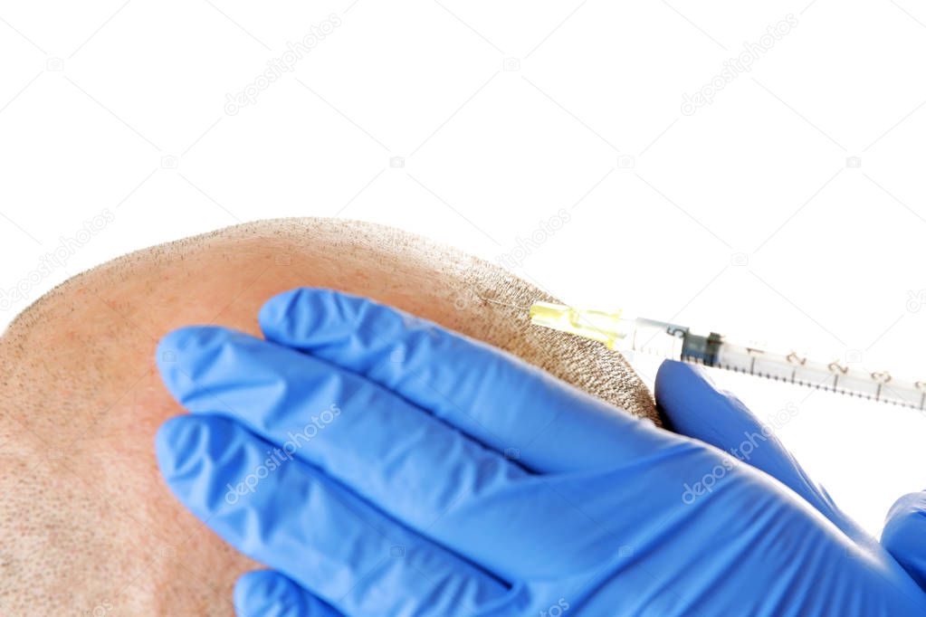 Man with hair loss problem receiving injection on white background, closeup
