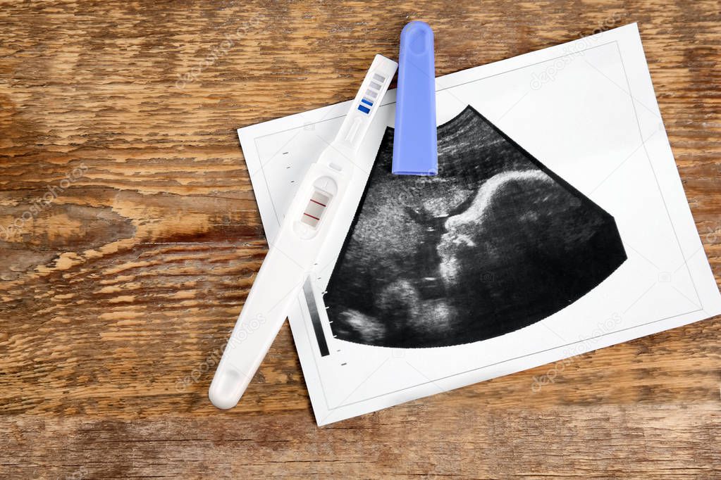 Ultrasound photo and pregnancy test 