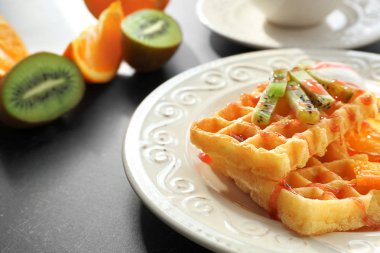 Tasty waffles with delicious fruits clipart