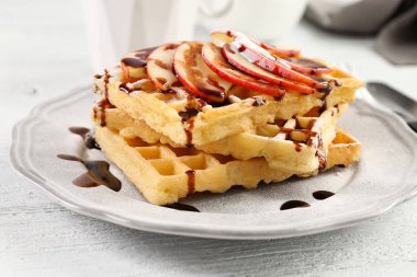 Delicious waffles with apple slices clipart
