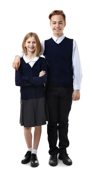可爱的女孩和男孩在学校制服白色背景 — 图库照片