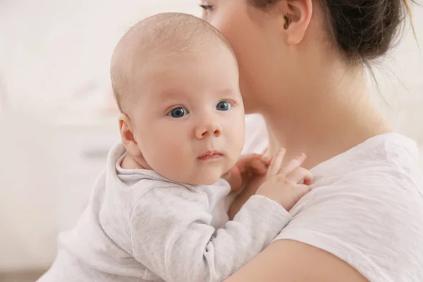 Young woman with cute little baby at home, closeup — Stock Photo, Image