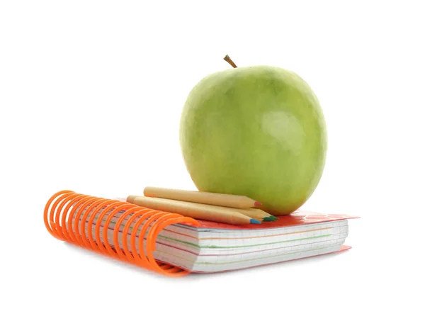 Apple with pencils and exercise book — Stock Photo, Image