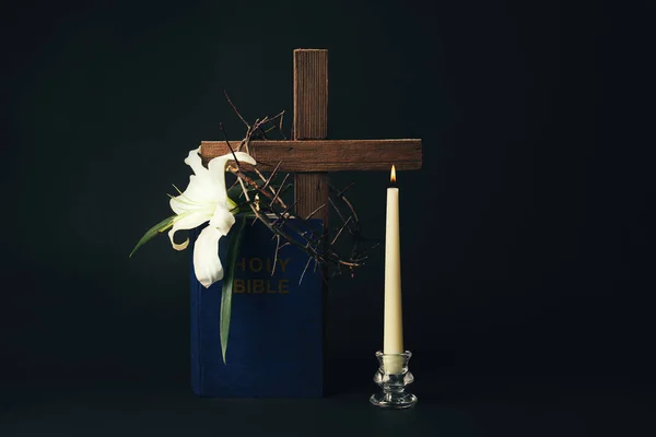 Bible, crown of thorns and white lily