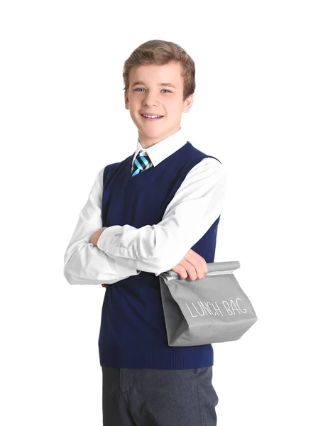 Estudante bonito com saco de almoço no fundo branco — Fotografia de Stock