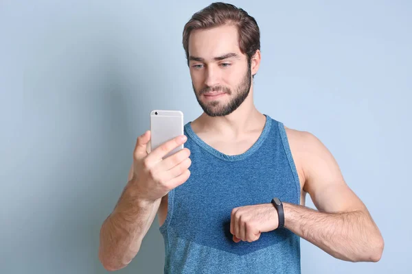 Handsome young man with fitness tracker — Stock Photo, Image