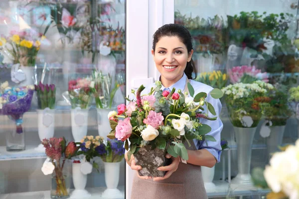 Beautiful woman florist Royalty Free Stock Photos