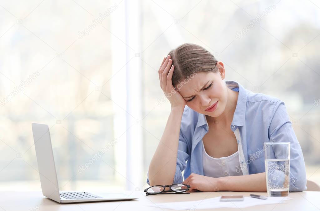 young woman suffering from headache
