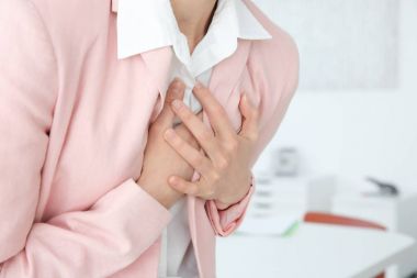 Woman suffering from chest pain  clipart