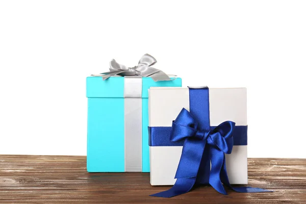 Beautiful gift boxes with satin ribbons — Stock Photo, Image