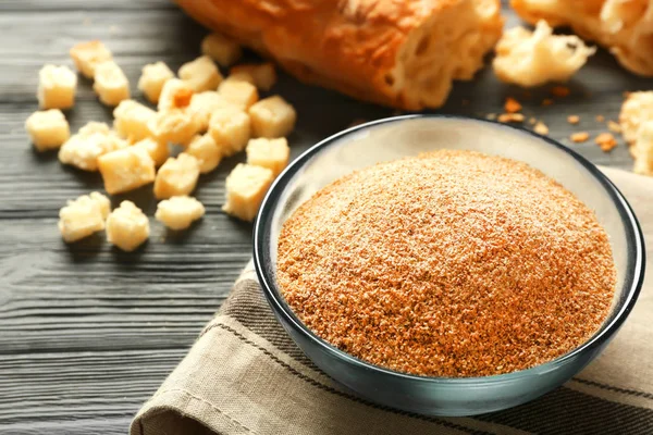 Glass bowl with bread crumbs — Stock Photo, Image