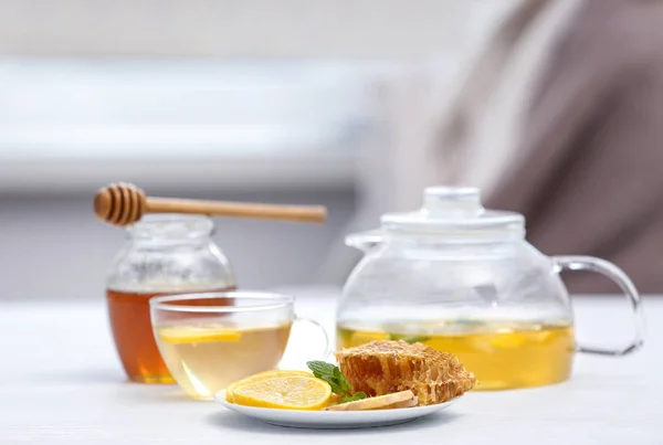 Herbal tea with lemon slices and honey — Stock Photo, Image