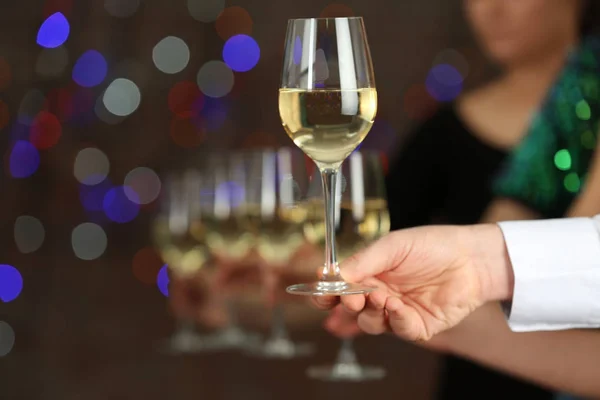 Male hand taking wine glass — Stock Photo, Image