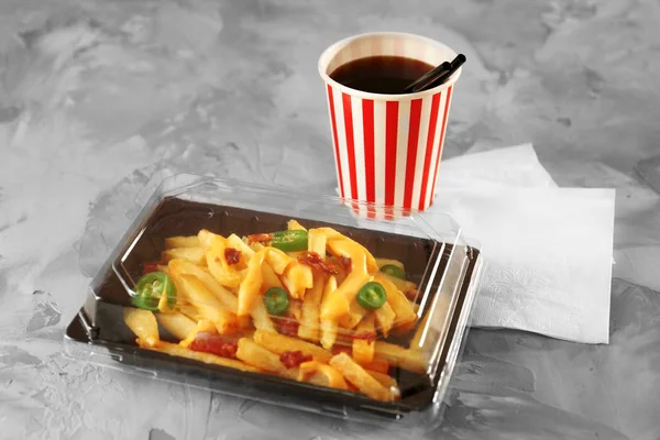 Cheese fries and cup of soda — Stock Photo, Image