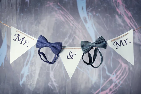 Paper garland and bow ties — Stock Photo, Image