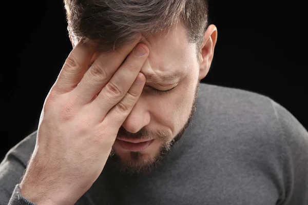 Young man suffering from headache — Stock Photo, Image