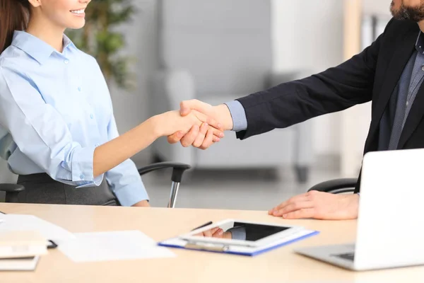 Manager and client shaking hands Stock Picture