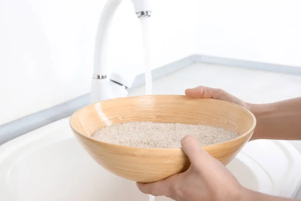 Woman holding bowl with rice — Stock Photo, Image