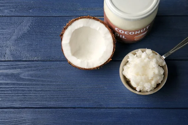 Metal scoop with fresh coconut oil — Stock Photo, Image