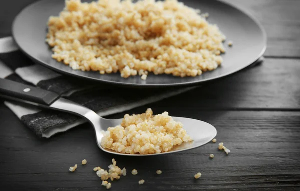 Spoon with boiled sprouted organic quinoa — Stock Photo, Image