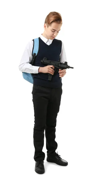 Schoolboy holding machine gun on white background — Stock Photo, Image