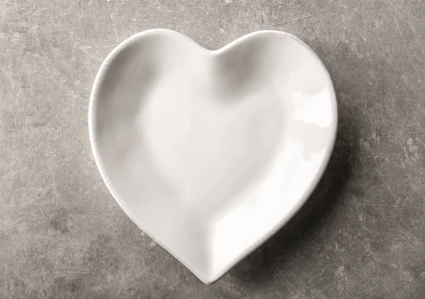 Plate in shape of heart — Stock Photo, Image