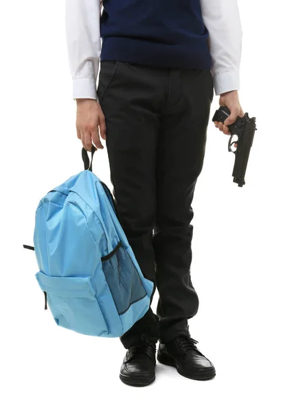 Colegial sosteniendo mochila y arma — Foto de Stock