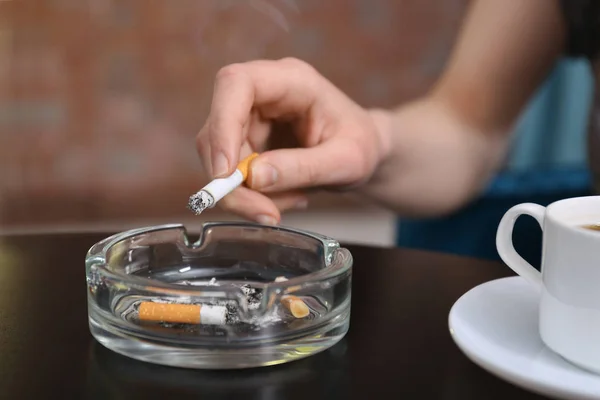 Smoking womans hand holding cigarette — Stock Photo, Image