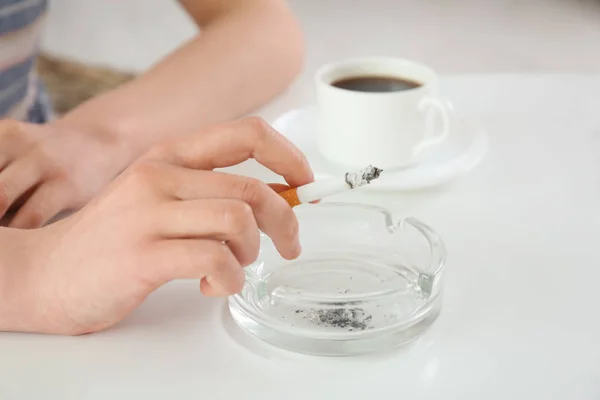 Smoking teenager holding cigarette — Stock Photo, Image