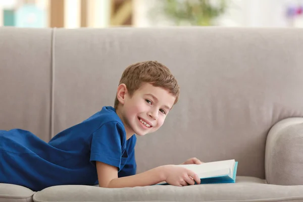Little Boy Reading Book Sofa Indoors — Stock Photo, Image