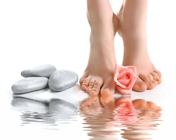 Female feet with rose — Stock Photo, Image