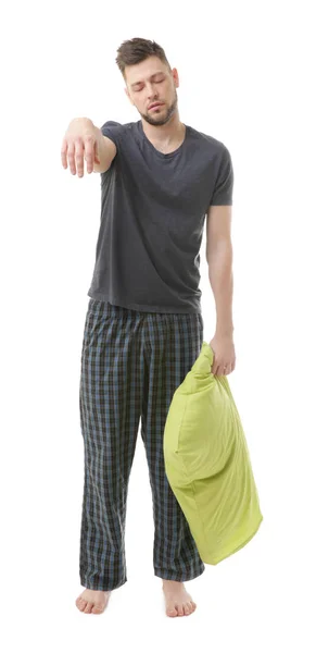 Junger schläfriger Mann im Pyjama — Stockfoto