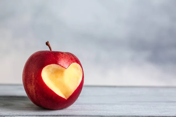 apple with heart-shaped cut out