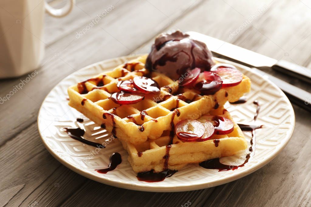 Tasty waffles with delicious grape