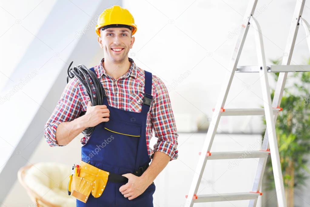 electrician standing near stepladder