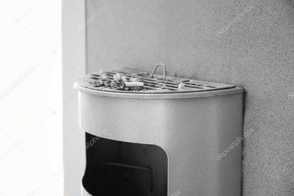 Trash bin with cigarettes butts 