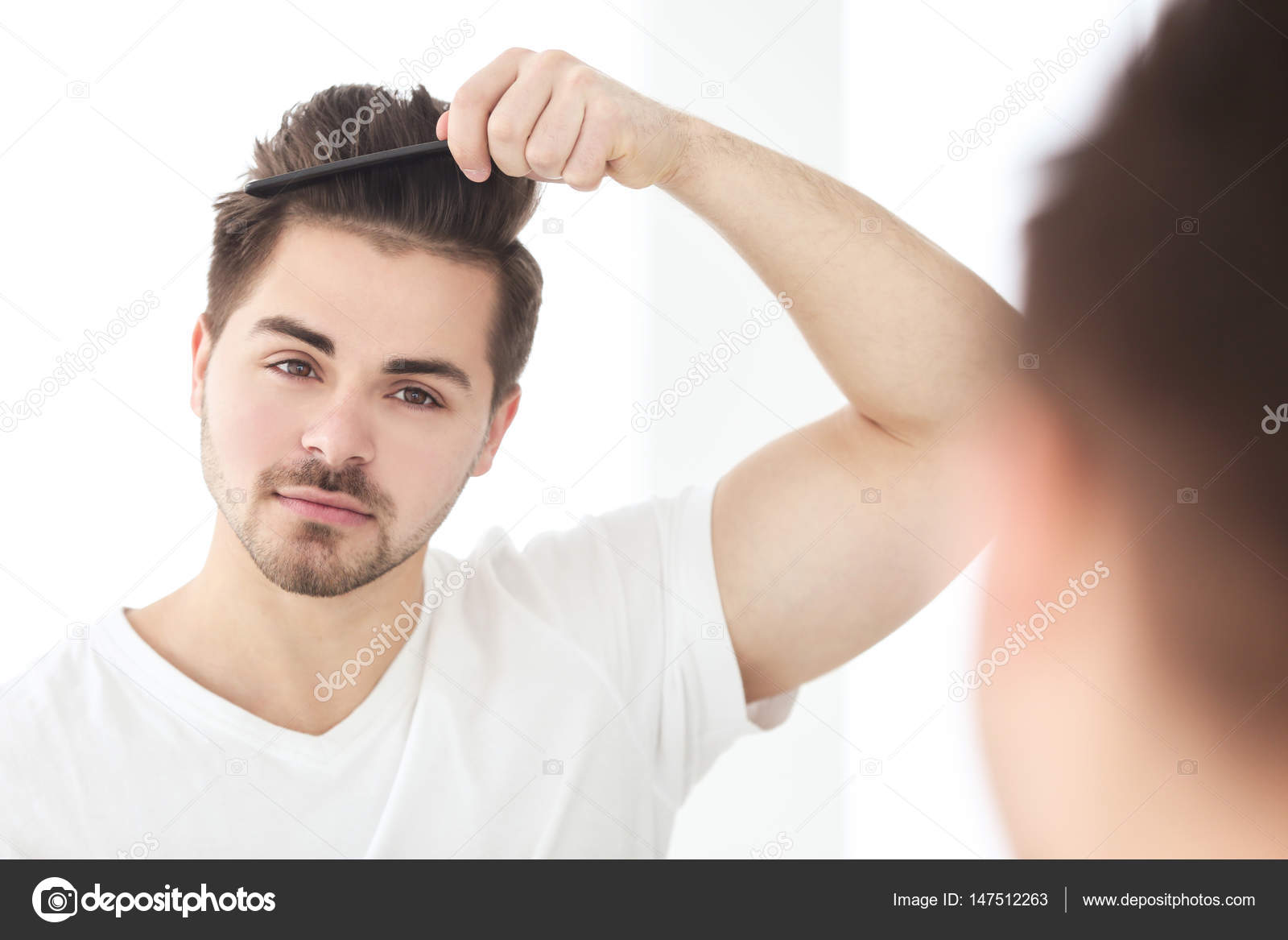 Handsome Young Man Combing Hair Stock Photo Belchonock 147512263 handsome-young-man-combing-hair-stock-photo-belchonock-147512263