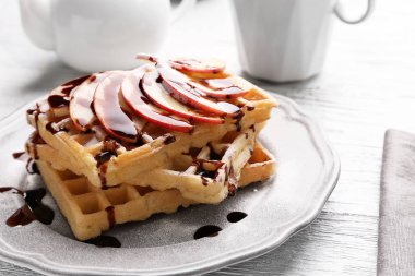 Delicious waffles with apple slices clipart