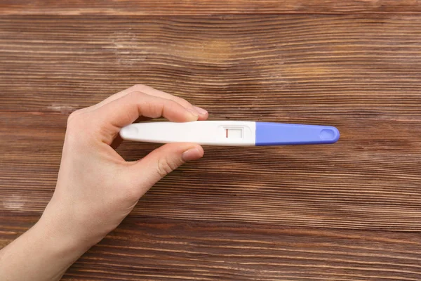 Pregnancy test in hand — Stock Photo, Image