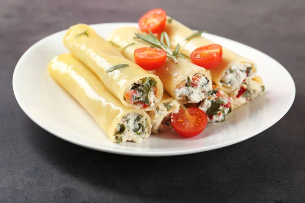 Stuffed cannelloni with cherry tomatoes — Stock Photo, Image