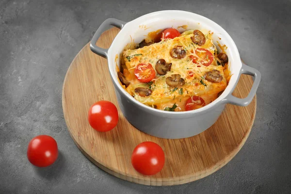 Delicious stuffed cannelloni with cherry tomatoes — Stock Photo, Image